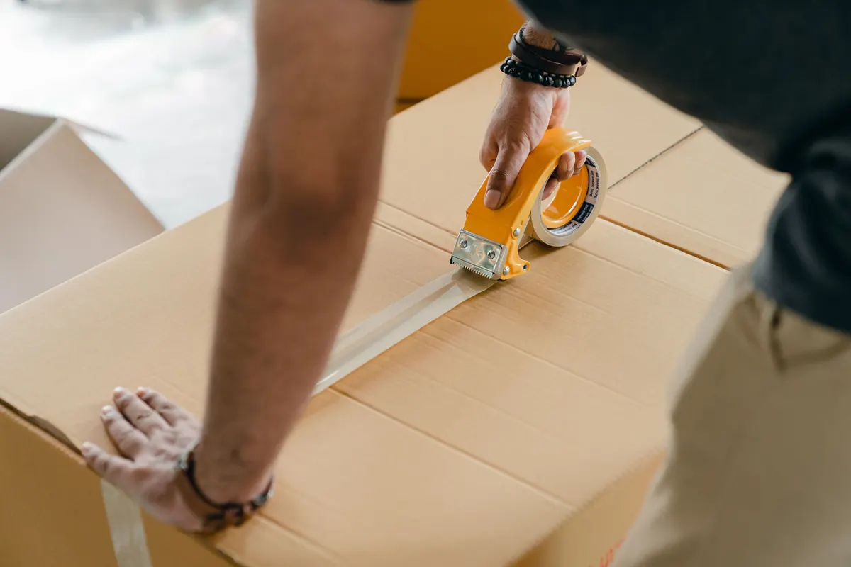 Carton being sealed for packing