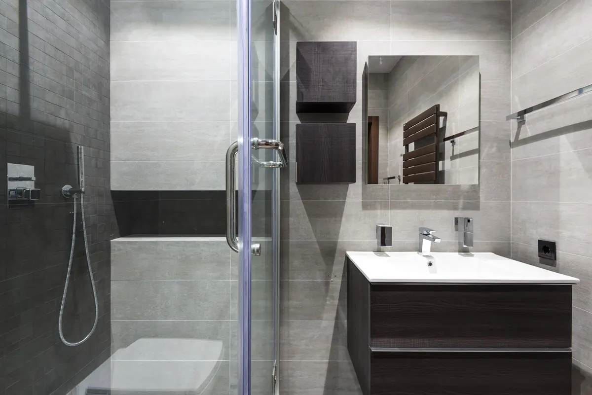 Bathroom interior with towel rail, vanity, and shower fittings