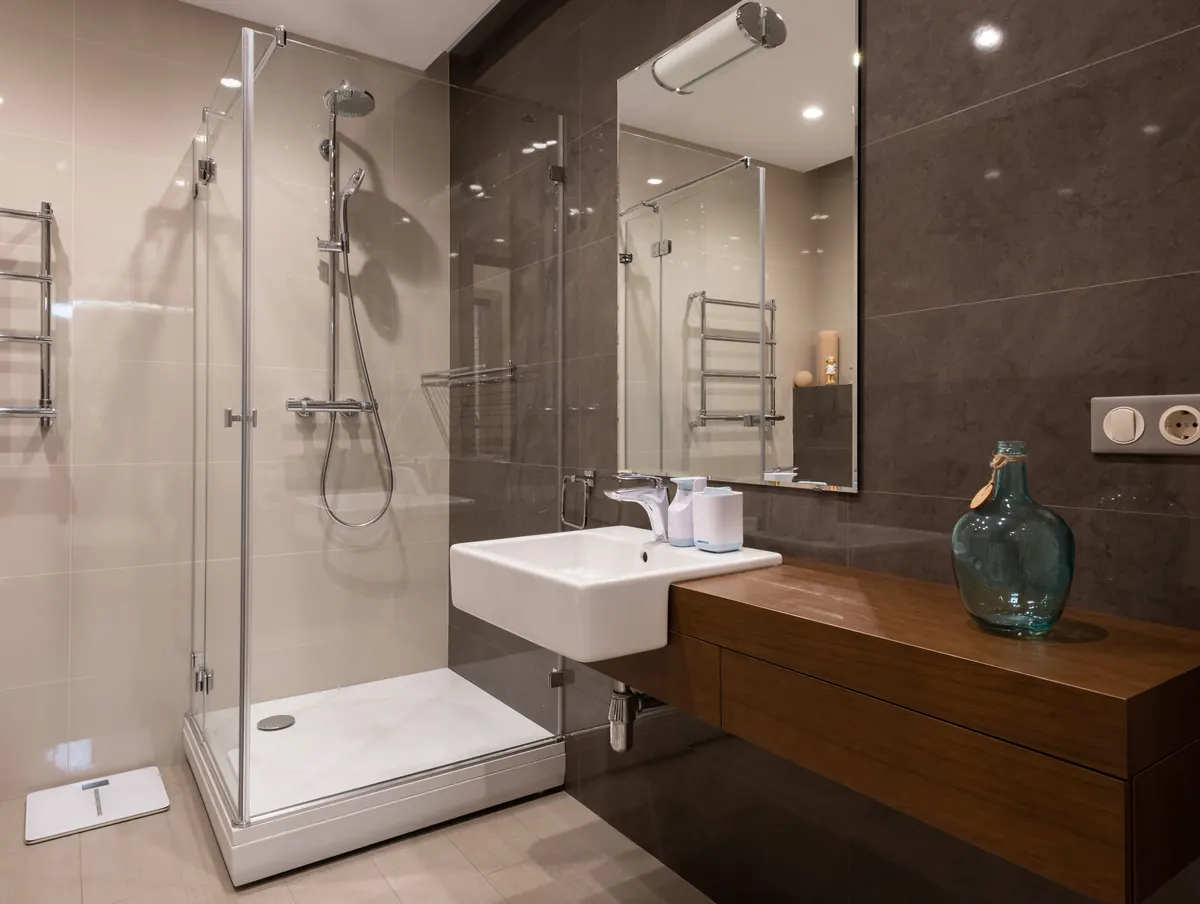 Bathroom interior with exposed shower and accessory fittings