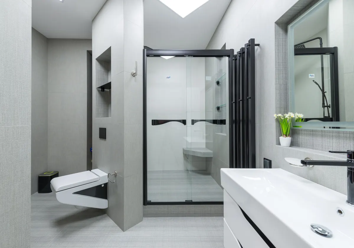 Bathroom with coordinated faucet, shower, and accessory hardware