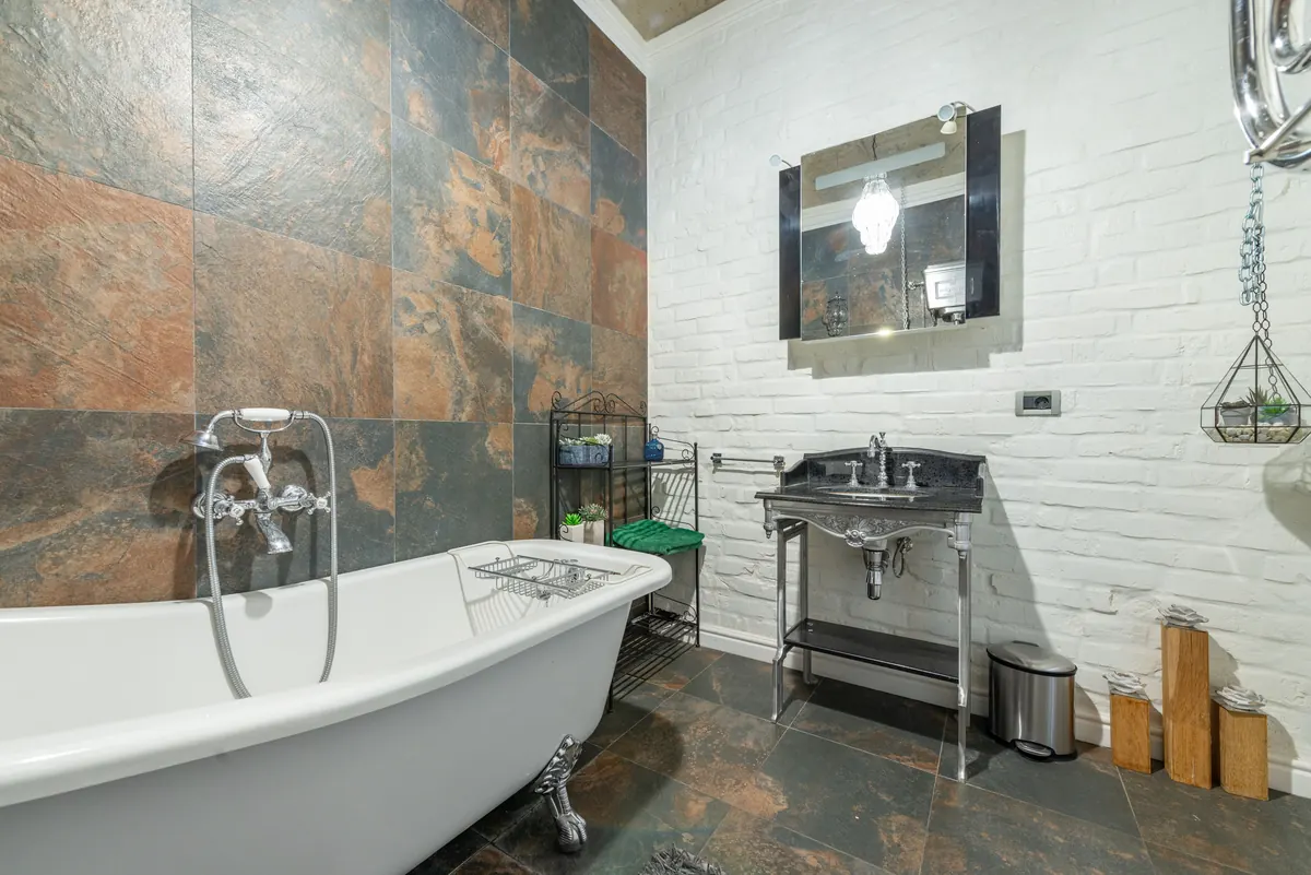 Hospitality bathroom with bath, basin, and coordinated fittings